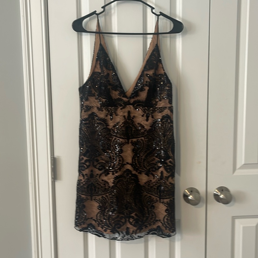 Free people cocktail dress size 4 black sequin with with nude color lining